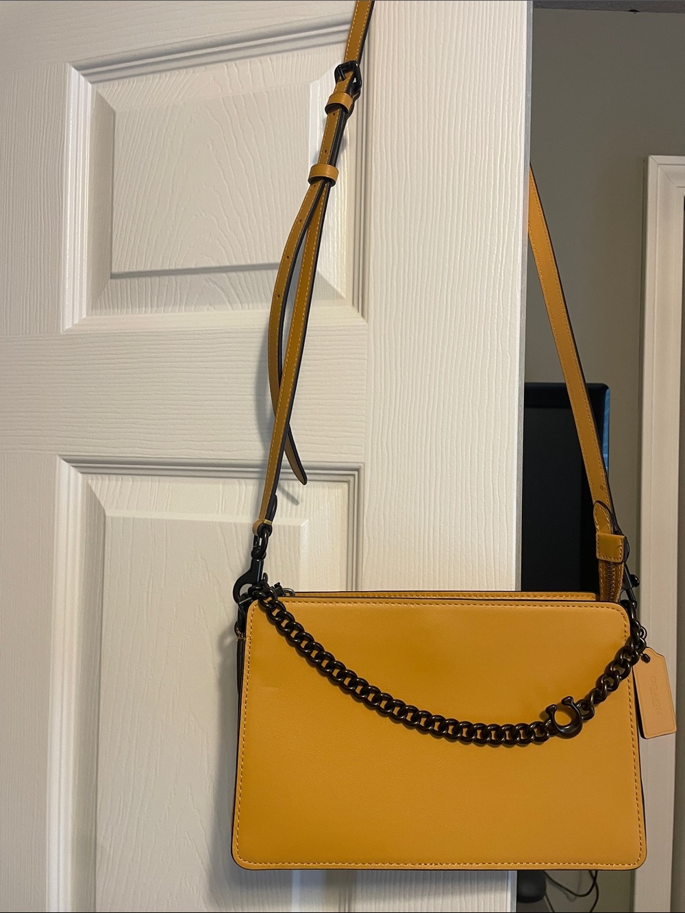 Elegant COACH Mustard Crossbody Bag with Black Chain Accent